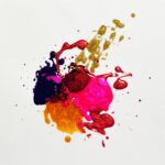 Colorful abstract paint splash on white background, capturing creative expression.